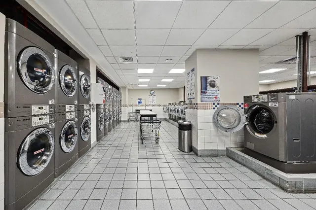 a view of a storage & utility room with washer and dryer