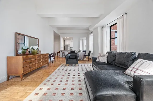 a living room with furniture and a rug