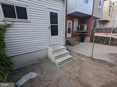 3175 Tulip Street Philadelphia, PA 19134 - Photo 11 of 12 a view of a patio with a table and chairs and potted plants