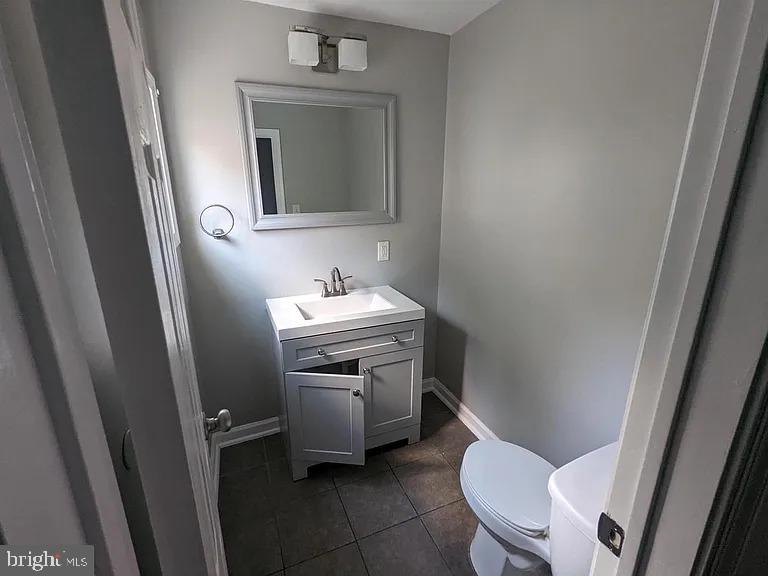 3175 Tulip Street Philadelphia, PA 19134 - Photo 4 of 12 a bathroom with a toilet sink and mirror