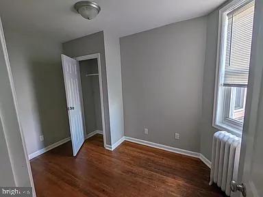 3175 Tulip Street Philadelphia, PA 19134 - Photo 8 of 12 an empty room with wooden floor and windows