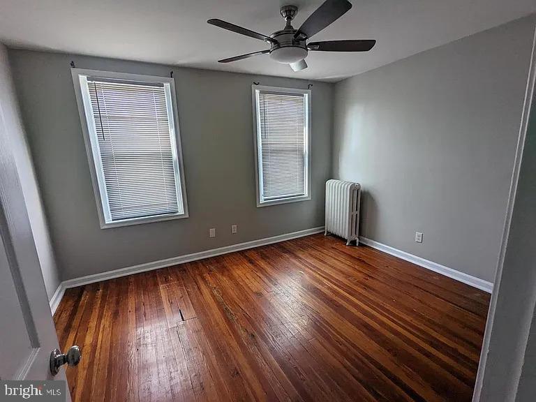 3175 Tulip Street Philadelphia, PA 19134 - Photo 10 of 12 a view of an empty room with wooden floor and a window