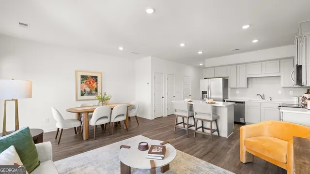 a kitchen with a sink cabinets and appliances