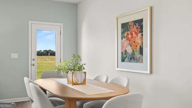 a living room with furniture a mirror and a table