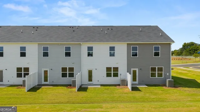 a room with cabinet a mirror and a glass door