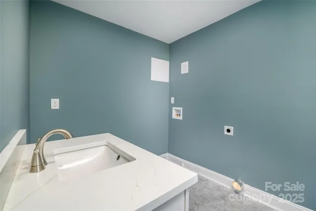 a bathroom with a sink and mirror