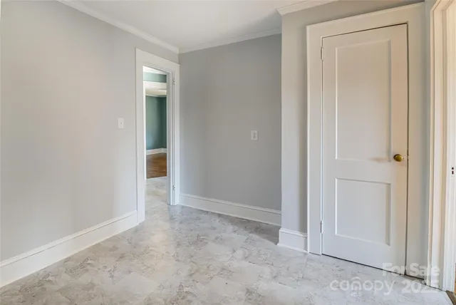 an empty room with closet area