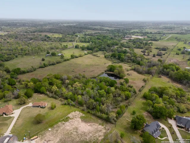 an aerial view of a houses with outdoor space