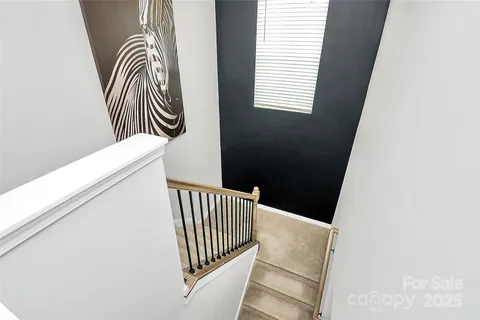 an entryway with a floor to ceiling window