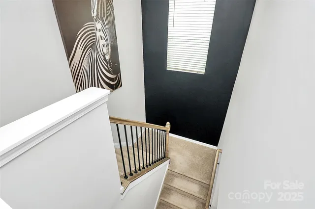 an entryway with a floor to ceiling window