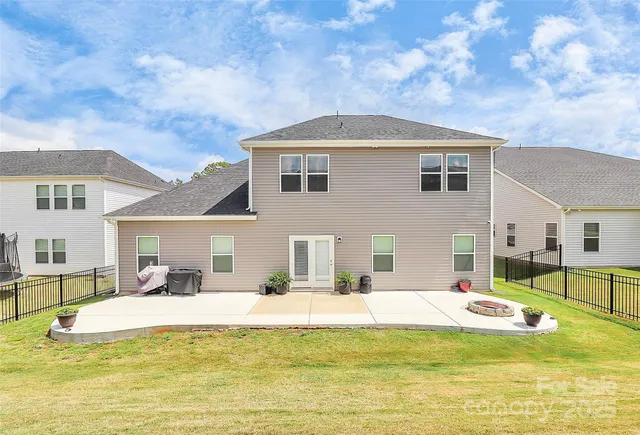a view of a house with swimming pool