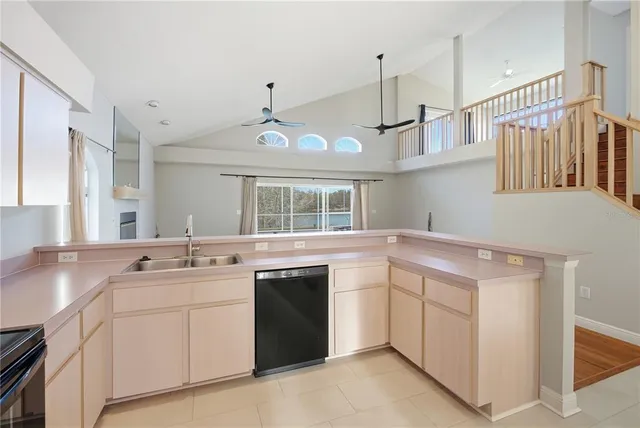 a kitchen that has a sink and a stove in it