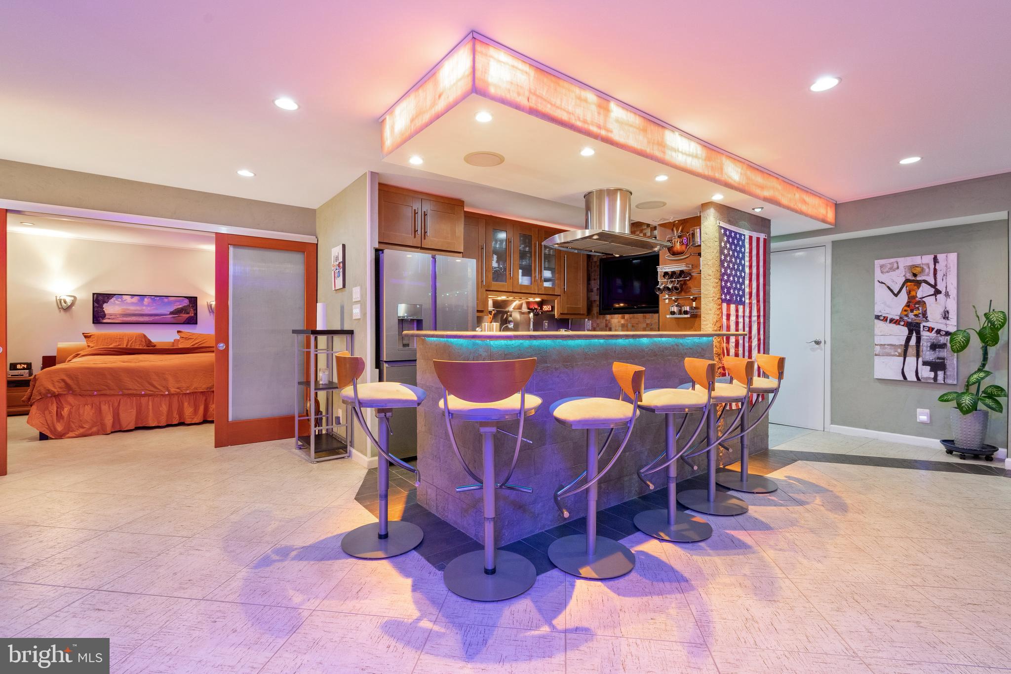 9701 Fields Road, Unit 201 Gaithersburg, MD 20878 - Photo 10 of 68 Night-time view of kitchen and island