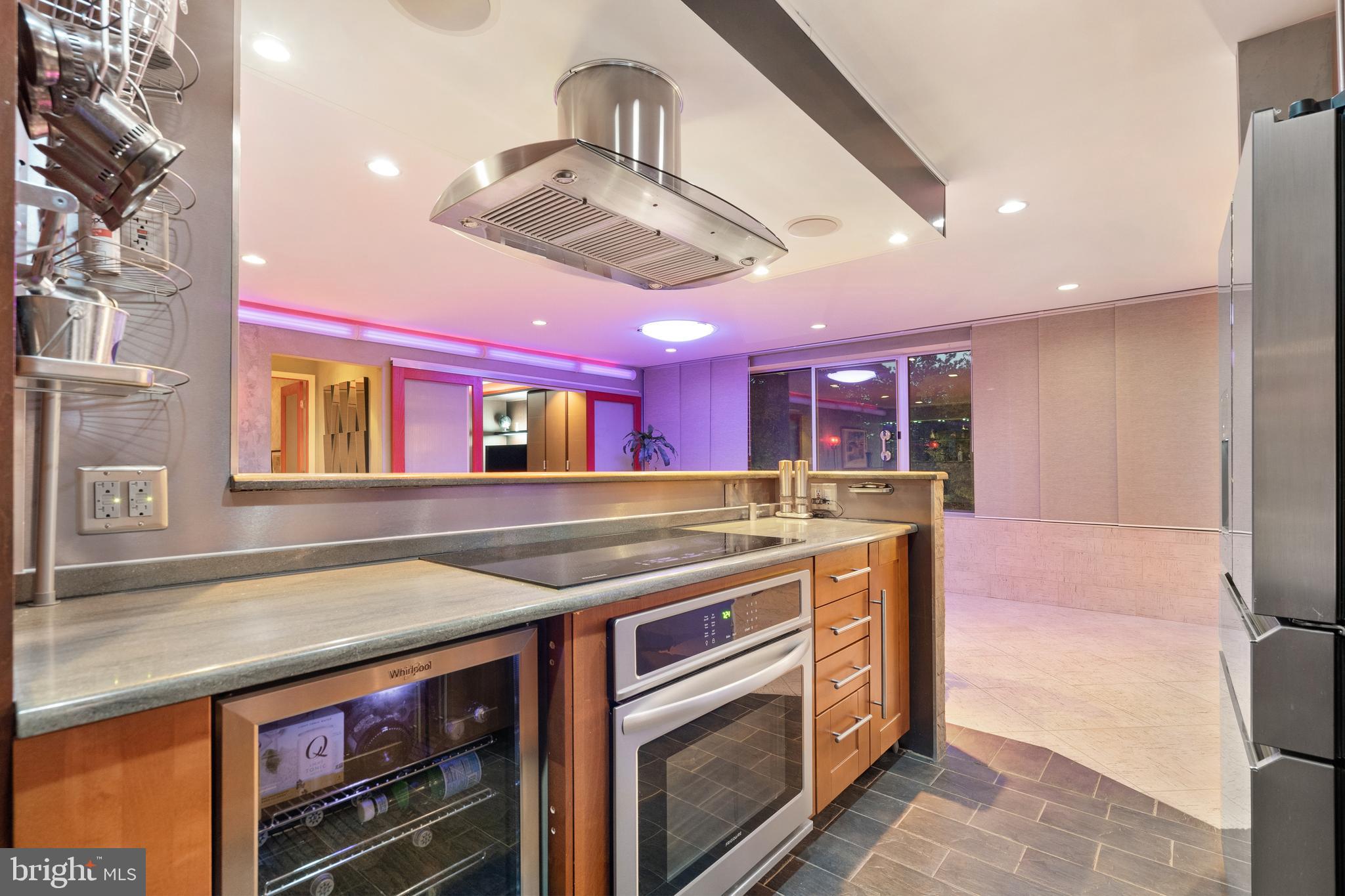 9701 Fields Road, Unit 201 Gaithersburg, MD 20878 - Photo 14 of 68 Fully equipped modern kitchen - night-time view