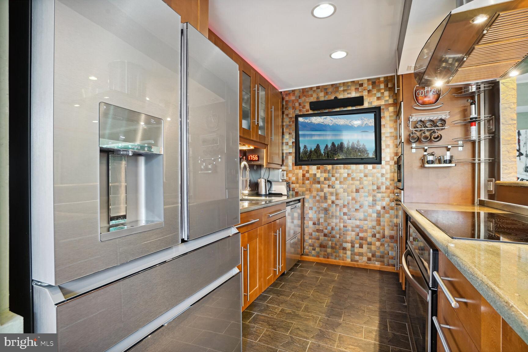 9701 Fields Road, Unit 201 Gaithersburg, MD 20878 - Photo 16 of 68 Top of the line appliances; TV conveys