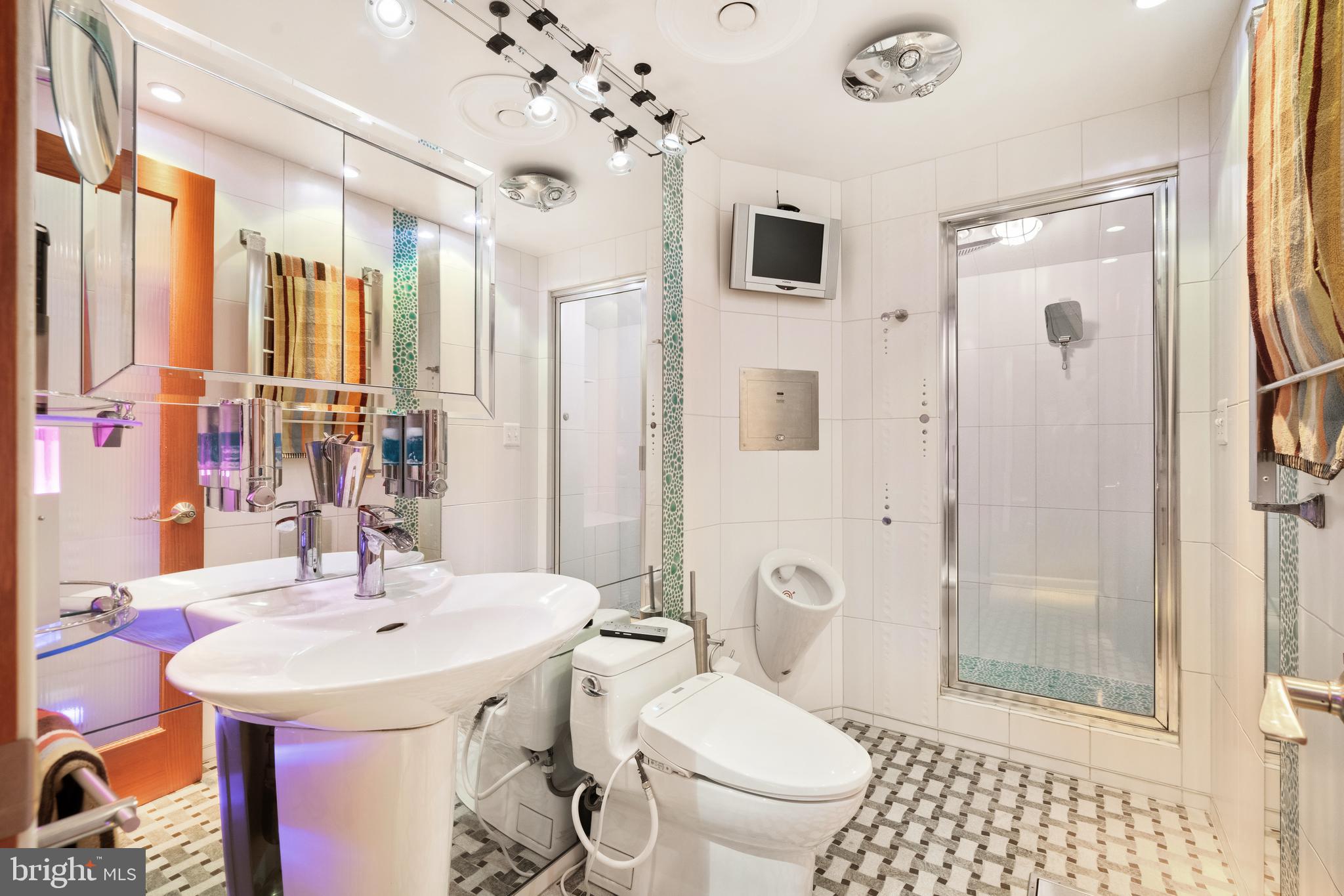 9701 Fields Road, Unit 201 Gaithersburg, MD 20878 - Photo 47 of 68 Guest Bathroom; steam shower combo; night-time