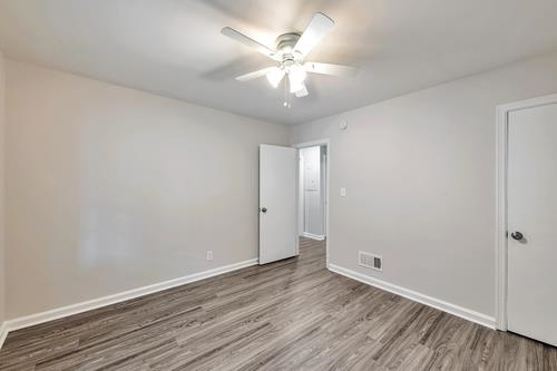 551 Wimbledon Road Northeast, Unit B Atlanta, GA 30324 - Photo 17 of 20 a view of an empty room with wooden floor