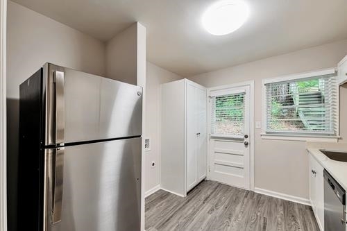 551 Wimbledon Road Northeast, Unit B Atlanta, GA 30324 - Photo 7 of 20 a white refrigerator freezer sitting in a kitchen