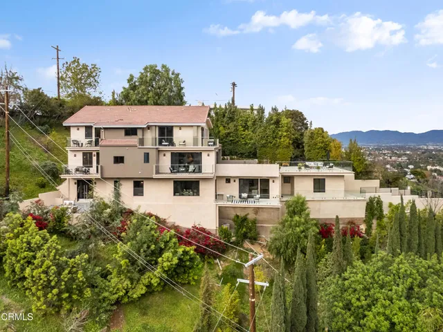 a living room with fireplace furniture and a flat screen tv