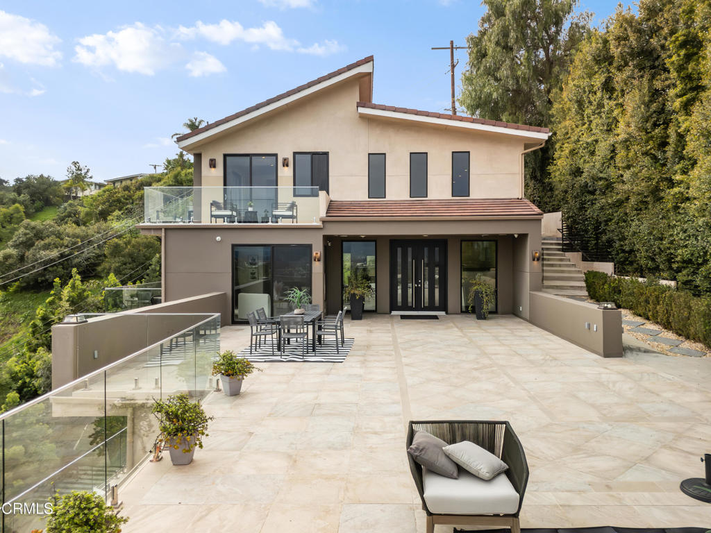 12480 Viewcrest Road Los Angeles, CA 91604 - Photo 13 of 69 a view of house with a yard outdoor seating and barbeque oven