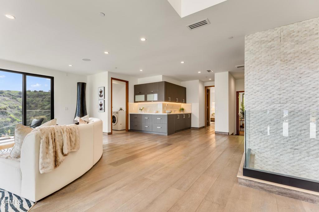 12480 Viewcrest Road Los Angeles, CA 91604 - Photo 17 of 69 a large white room with a large window and furniture