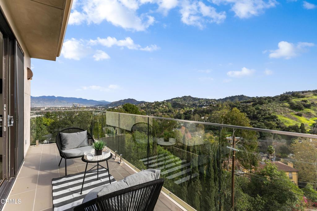 12480 Viewcrest Road Los Angeles, CA 91604 - Photo 20 of 69 a view of a lake with a table and chairs