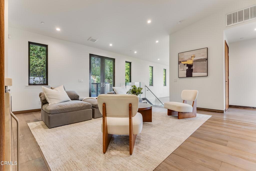 12480 Viewcrest Road Los Angeles, CA 91604 - Photo 21 of 69 a living room with furniture and wooden floor
