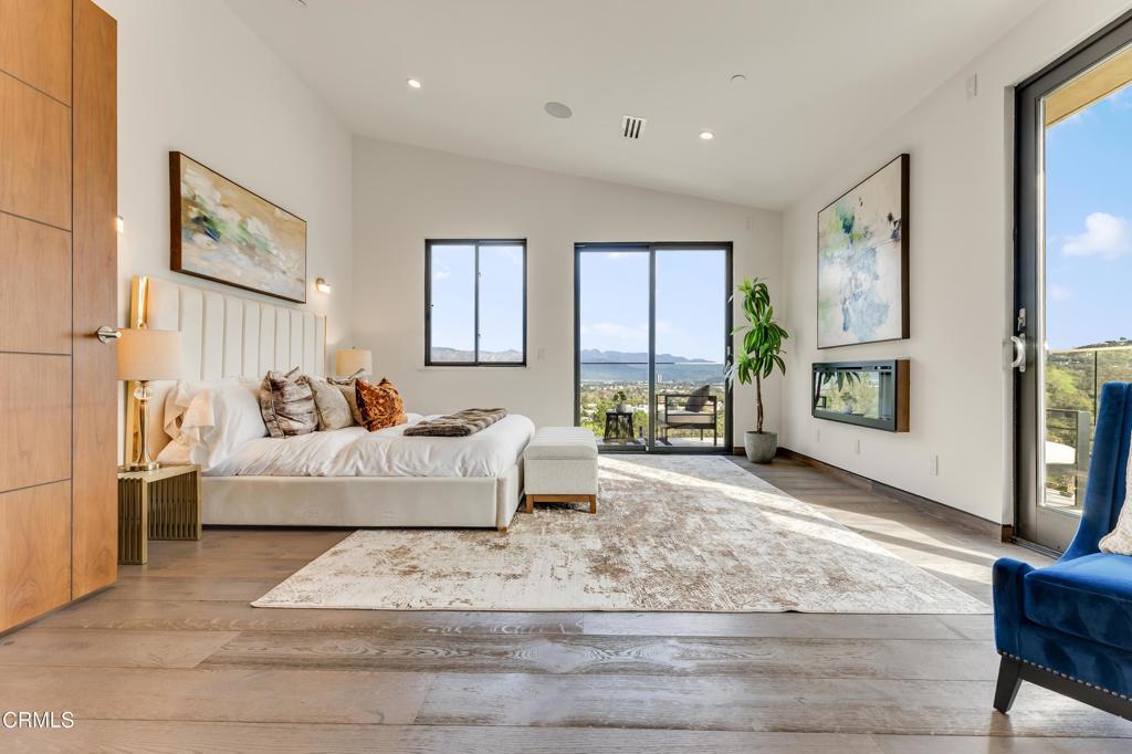 12480 Viewcrest Road Los Angeles, CA 91604 - Photo 24 of 69 a living room with furniture and a fireplace