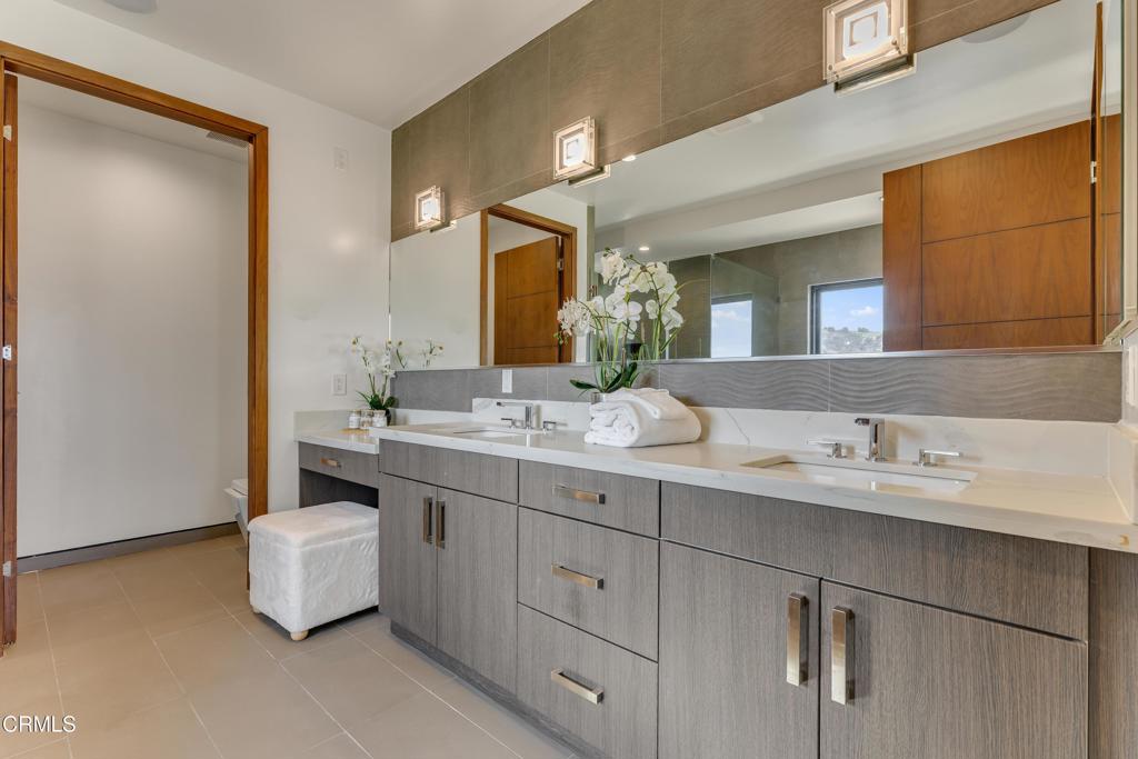 12480 Viewcrest Road Los Angeles, CA 91604 - Photo 27 of 69 a bathroom with a sink and a mirror