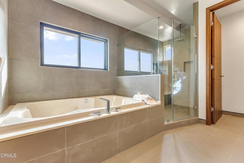 12480 Viewcrest Road Los Angeles, CA 91604 - Photo 28 of 69 a bathroom with a bathtub and a shower