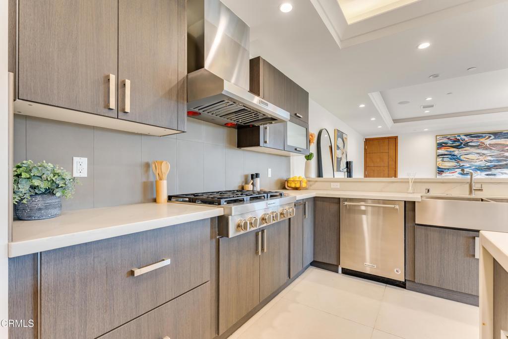 12480 Viewcrest Road Los Angeles, CA 91604 - Photo 3 of 69 a kitchen with stainless steel appliances granite countertop a white cabinets and a stove