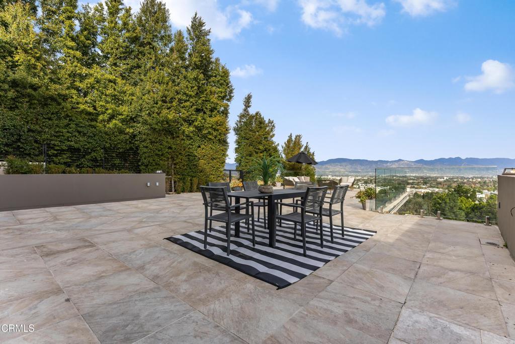 12480 Viewcrest Road Los Angeles, CA 91604 - Photo 37 of 69 a view of a chairs and table on the terrace