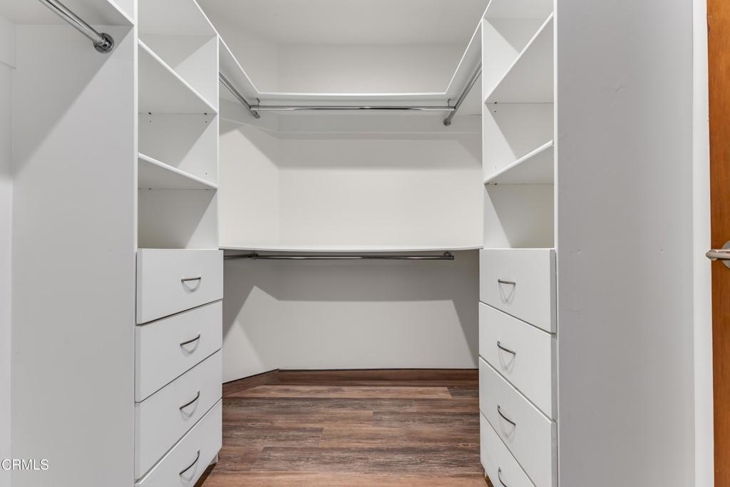 12480 Viewcrest Road Los Angeles, CA 91604 - Photo 39 of 69 a room with white cabinets and wooden floors