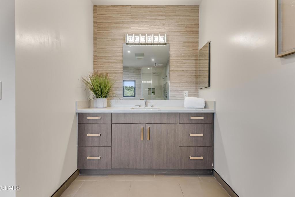 12480 Viewcrest Road Los Angeles, CA 91604 - Photo 40 of 69 a bathroom with a sink and a mirror