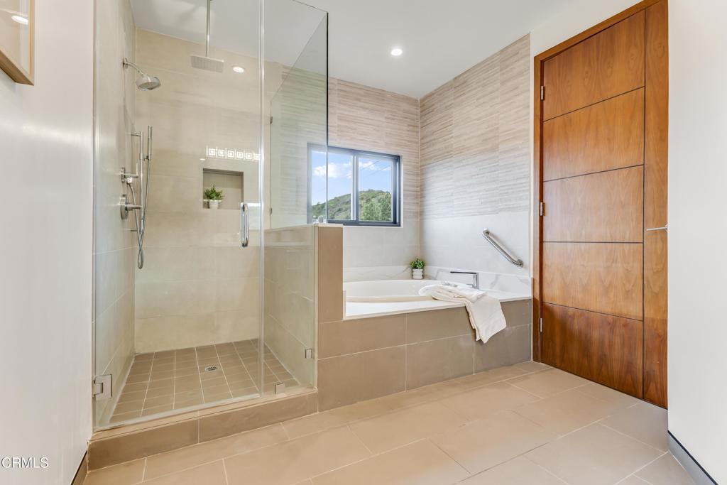12480 Viewcrest Road Los Angeles, CA 91604 - Photo 41 of 69 a bathroom with a bathtub and a shower