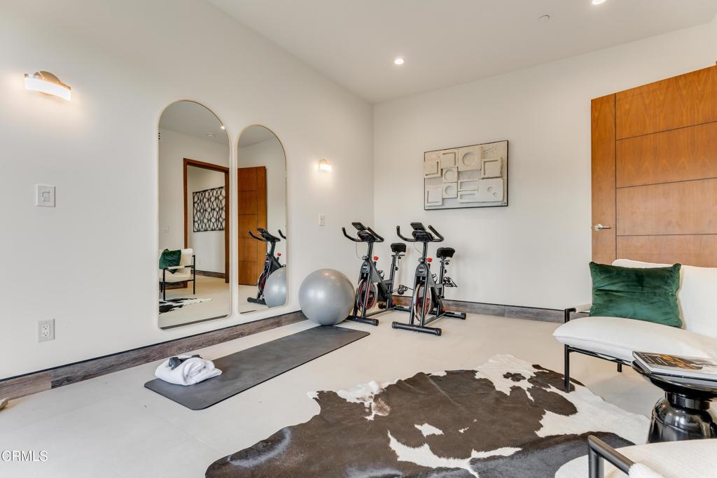 12480 Viewcrest Road Los Angeles, CA 91604 - Photo 50 of 69 a room with gym equipment and view of living room
