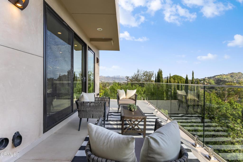 12480 Viewcrest Road Los Angeles, CA 91604 - Photo 62 of 69 a view of a roof deck with couches and potted plants