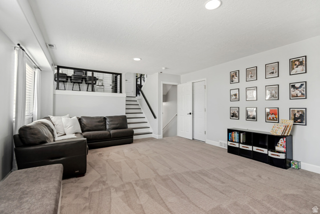 4752 South 4075th Street West Roy, UT 84067 - Photo 8 of 28 Spacious finished basement featuring light gray walls, recessed lighting, and neutral-toned carpeting