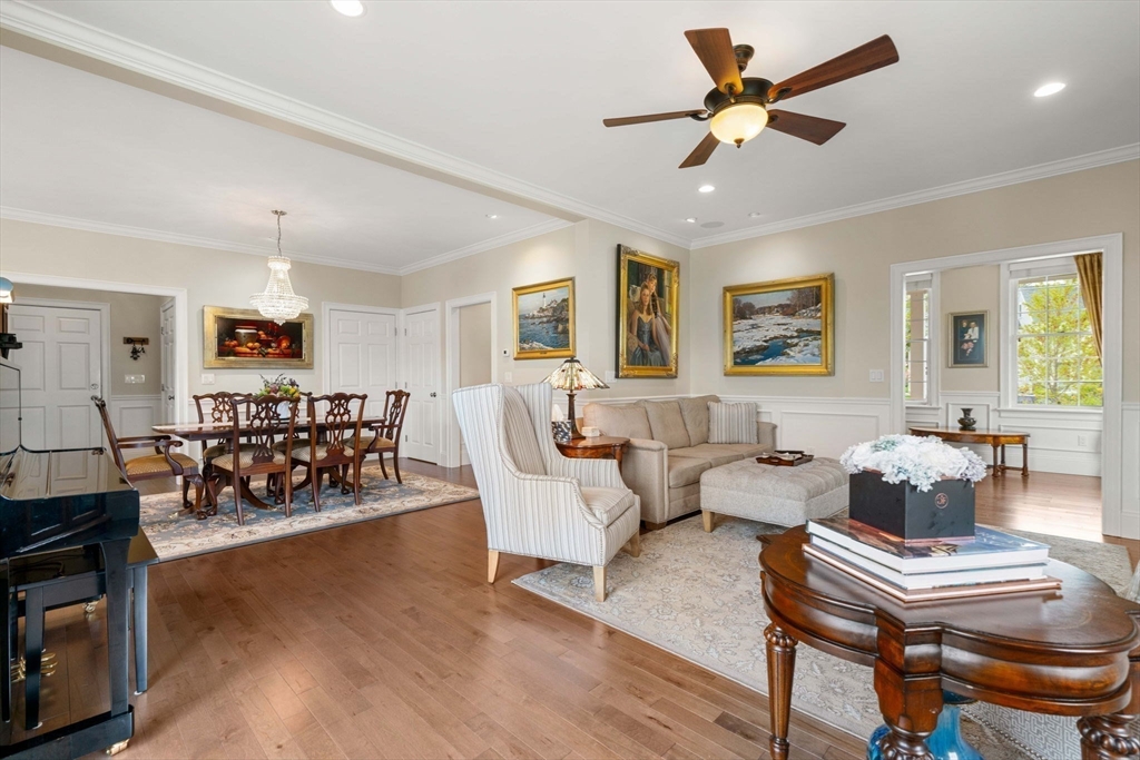 4 Point Shore Overlook Amesbury, MA 01913 - Photo 10 of 42 a living room with furniture and a dining table with wooden floor