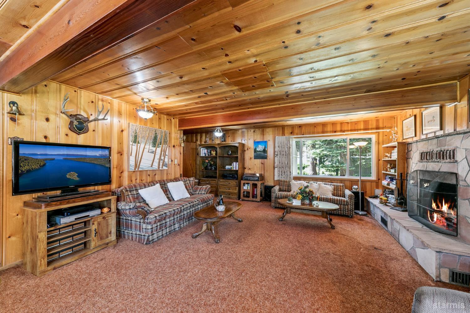7075 Mount Ralston Road Twin Bridges, CA 95735 - Photo 13 of 26 a living room with furniture and a fireplace