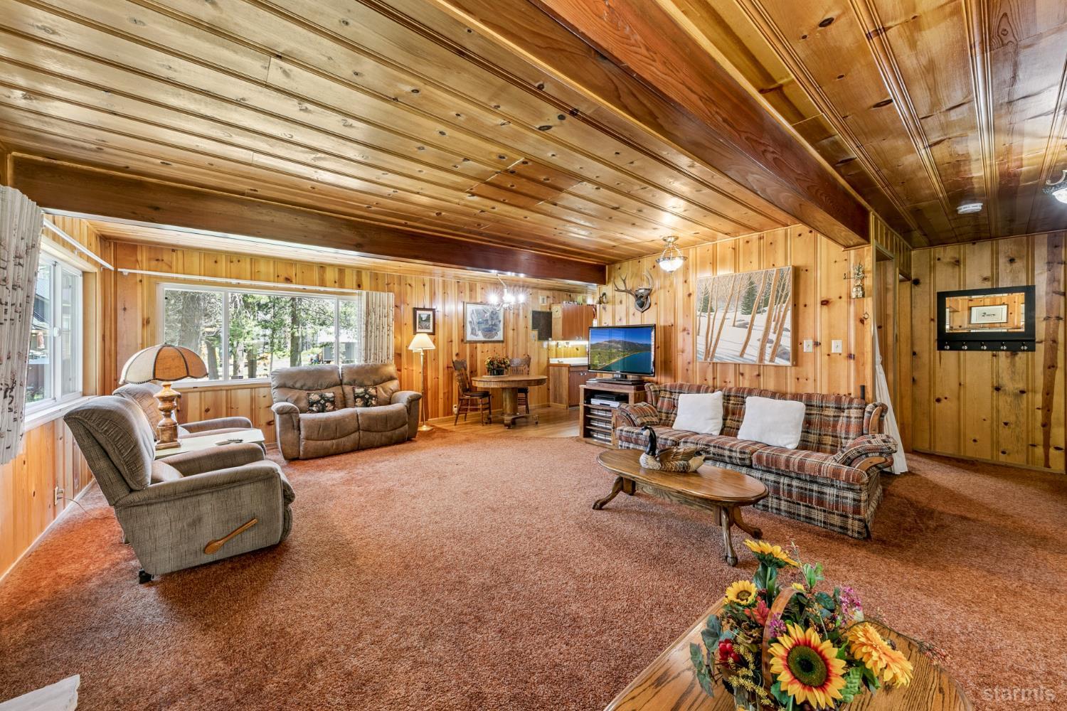 7075 Mount Ralston Road Twin Bridges, CA 95735 - Photo 16 of 26 a living room with furniture gym equipment and a large window