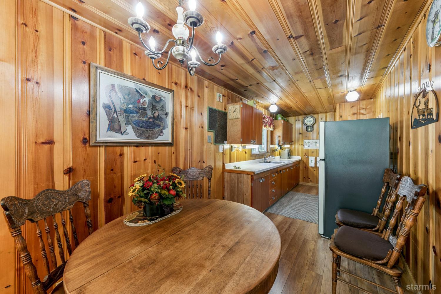 7075 Mount Ralston Road Twin Bridges, CA 95735 - Photo 17 of 26 a room with stainless steel appliances kitchen island granite countertop furniture and a chandelier