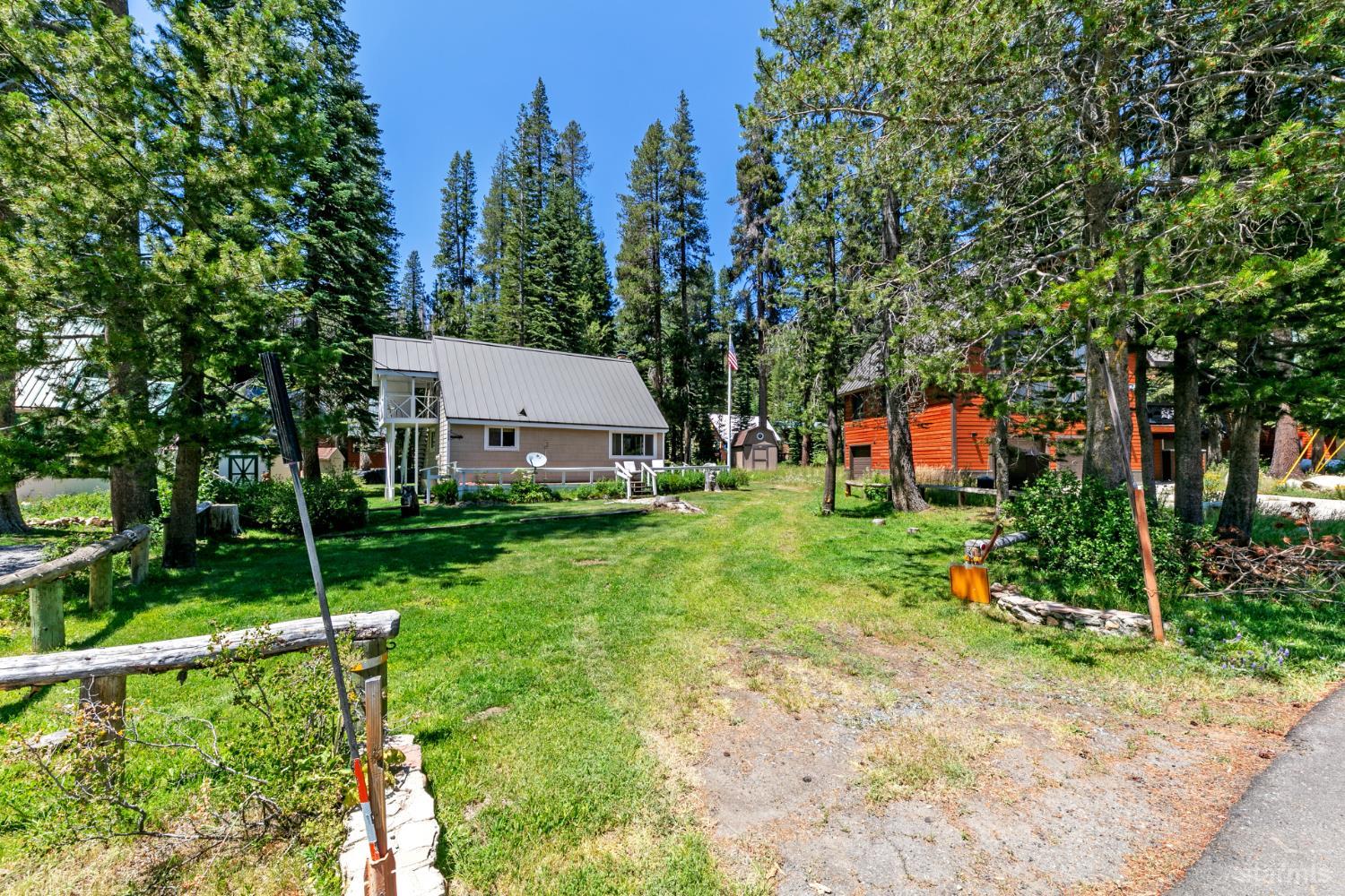 7075 Mount Ralston Road Twin Bridges, CA 95735 - Photo 2 of 26 a view of house with backyard space and garden