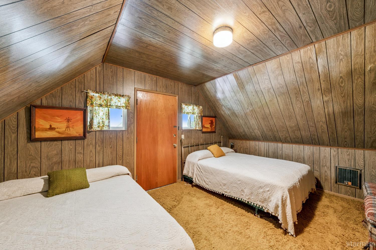 7075 Mount Ralston Road Twin Bridges, CA 95735 - Photo 25 of 26 a bedroom with a bed and a night stand