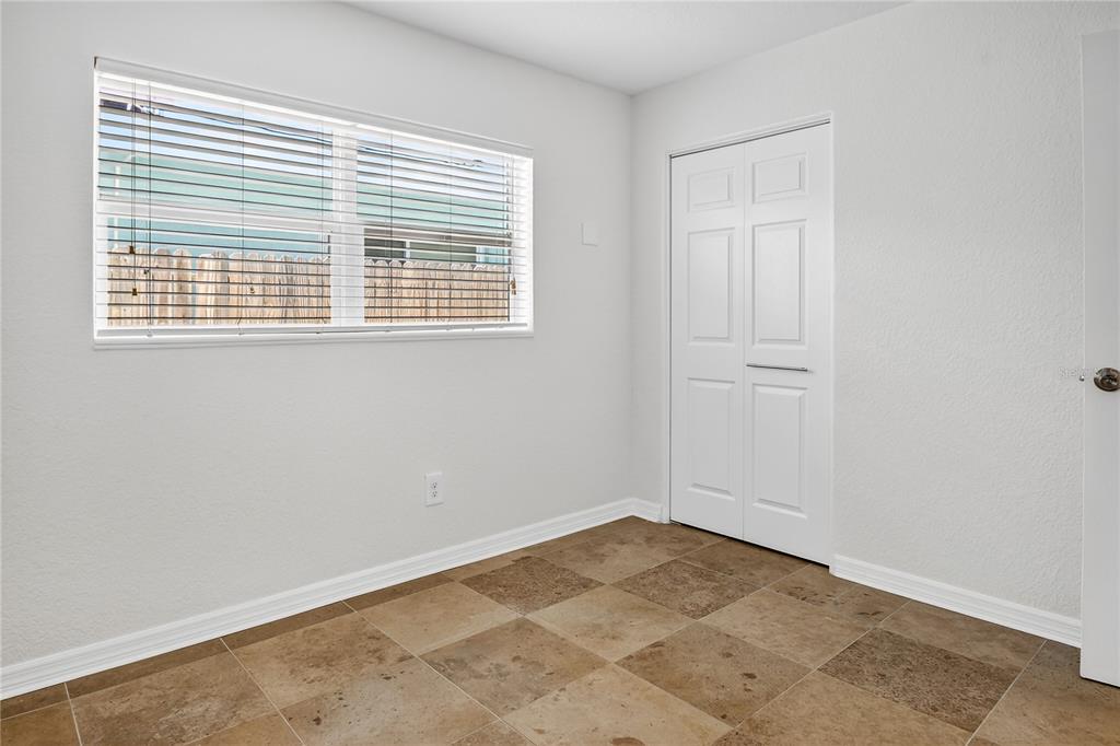 13440 1st Street East Madeira Beach, FL 33708 - Photo 25 of 44 a view of an empty room with a window