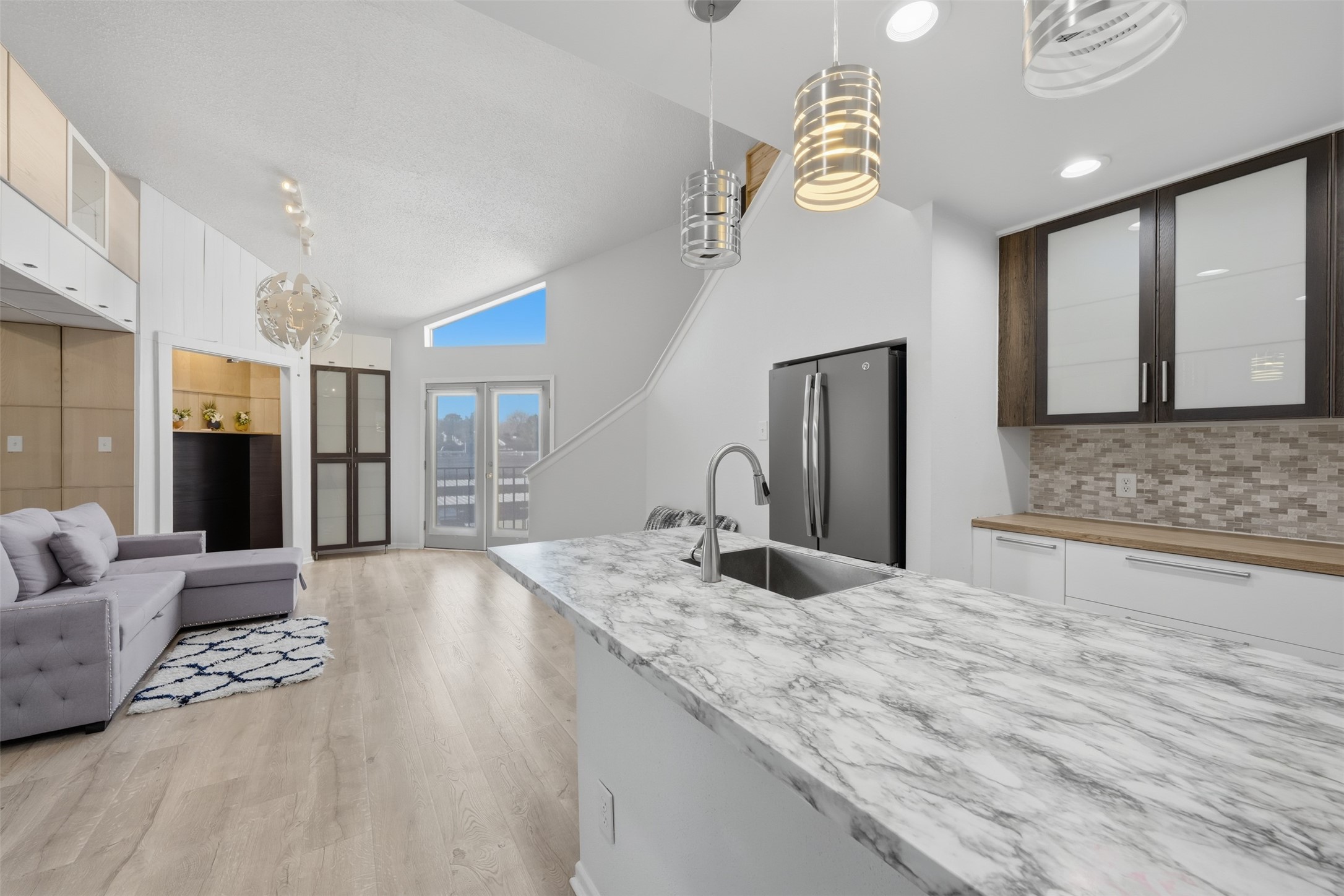 10855 Meadowglen Lane, Unit 823 Houston, TX 77042 - Photo 15 of 35 a spacious bathroom with a granite countertop sink a mirror and shower