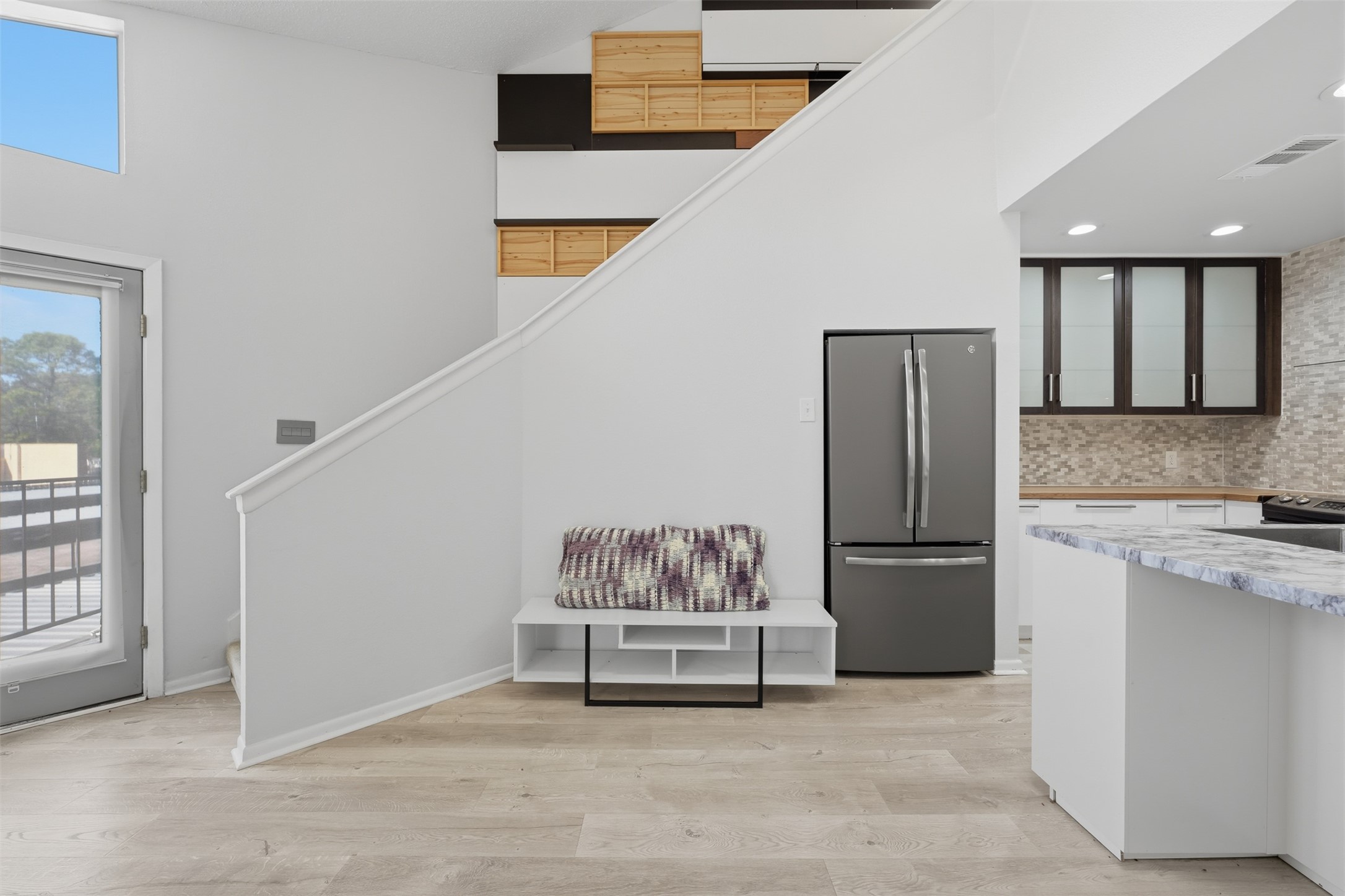10855 Meadowglen Lane, Unit 823 Houston, TX 77042 - Photo 2 of 35 a kitchen with refrigerator and cabinets