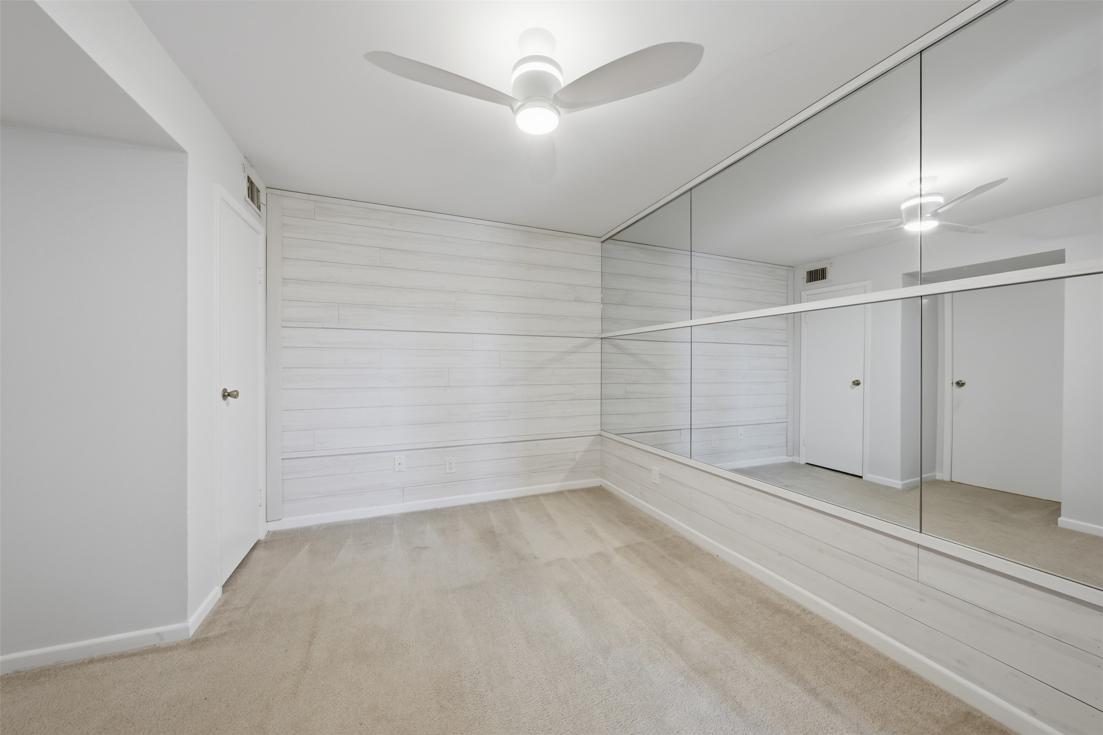 10855 Meadowglen Lane, Unit 823 Houston, TX 77042 - Photo 10 of 35 wooden floor in an empty room