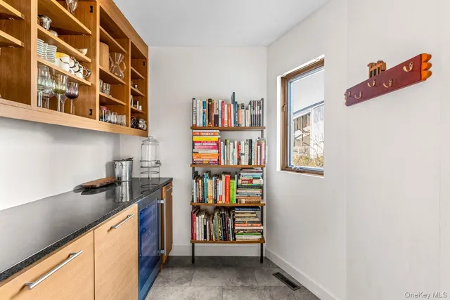 a room with a book shelf and a wooden floor