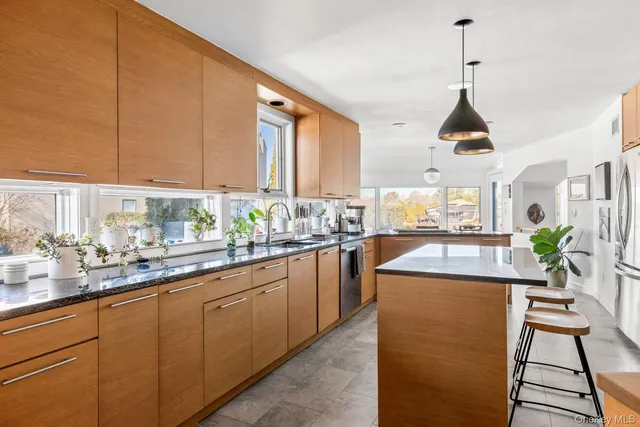 a kitchen with sink cabinets and window